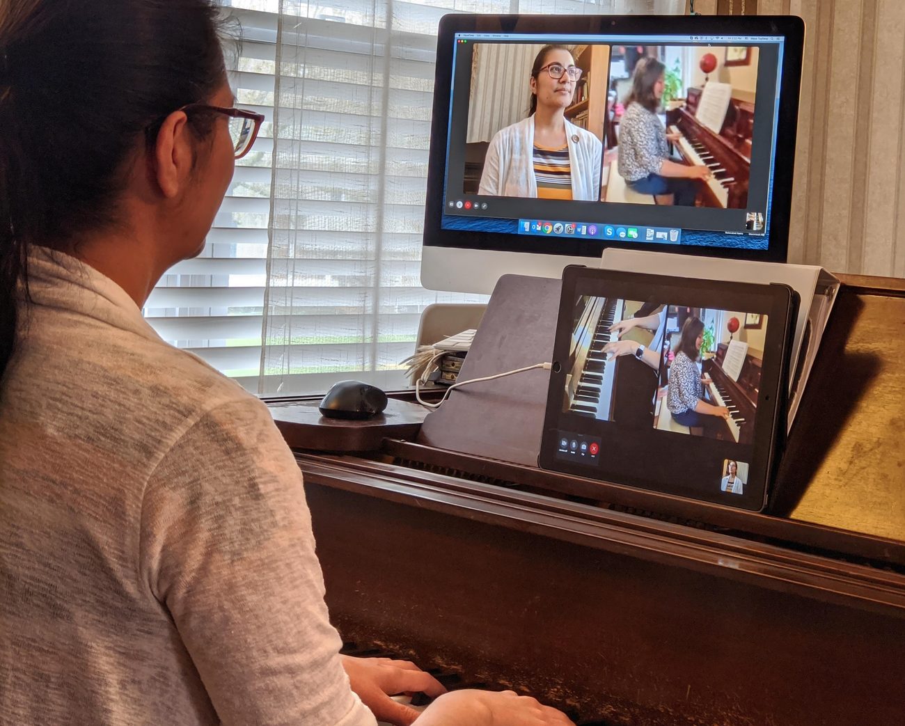 A piano lesson taught online over video