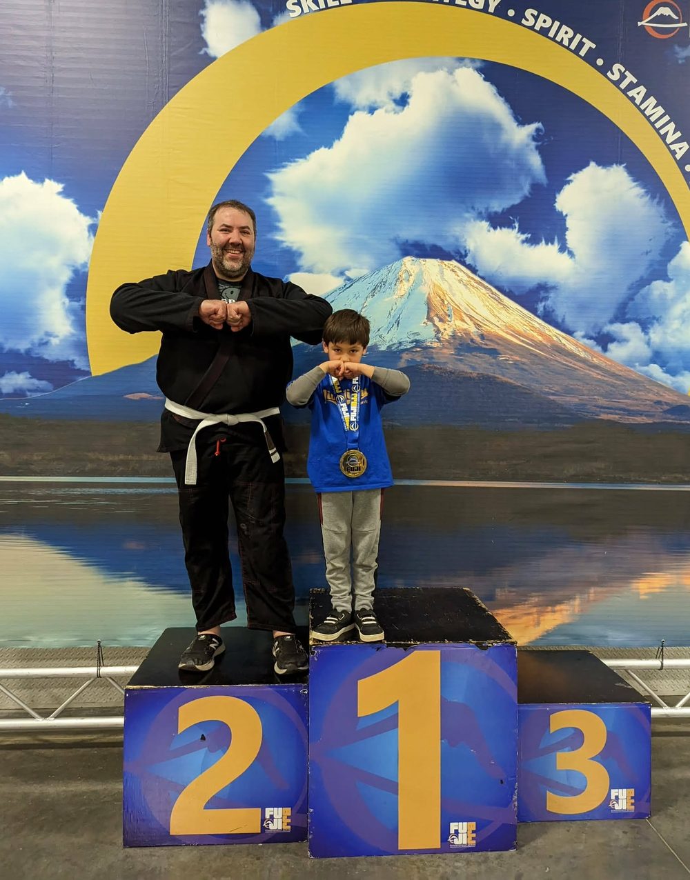 A young student on the first-place tournament podium